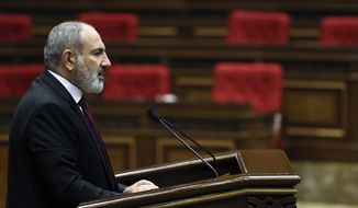 Armenian Prime Minister Nikol Pashinyan delivers his speech at the National Assembly of Armenia in Yerevan, Armenia, Tuesday, Sept. 13, 2022. Armenia&#39;s prime minister says that 49 soldiers have been killed in nighttime attacks by Azerbaijan. (Tigran Mehrabyan/PAN Photo via AP)