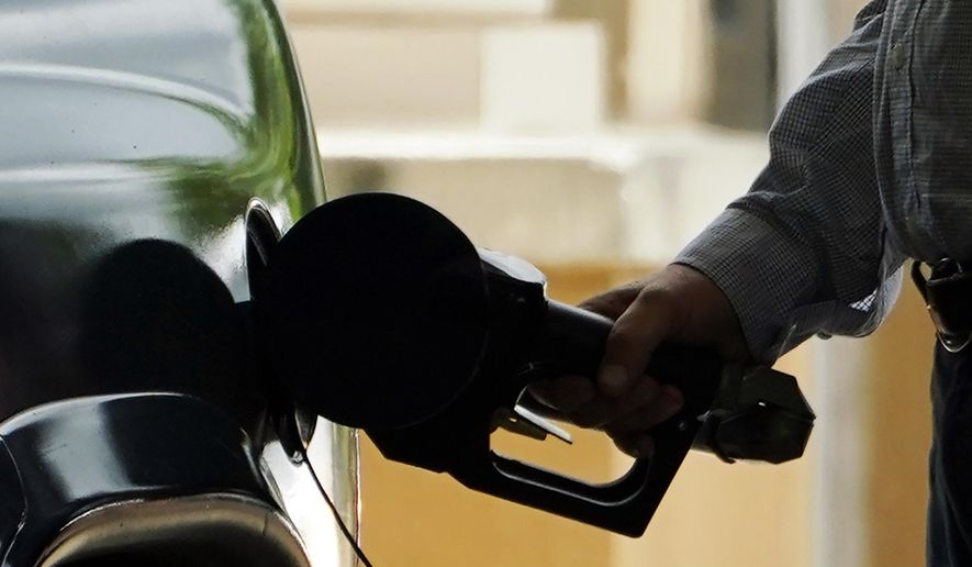 A customer pumps gas into his vehicle at this Madison, Miss., Sam's Club, on May 24, 2022. (AP Photo/Rogelio V. Solis, File)