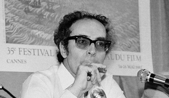 Film director Jean-Luc Godard smokes at Cannes festival in France on May 25, 1982. Godard, an icon of French New Wave film who revolutionized popular 1960s cinema, has died, according to French media. He was 91. Born into a wealthy French-Swiss family on Dec. 3, 1930, in Paris, the ingenious &amp;quot;enfant terrible&amp;quot; stood for years as one of the world&#39;s most vital and provocative directors in Europe and beyond — beginning in 1960 with his debut feature &amp;quot;Breathless.&amp;quot; (AP Photo/Jean-Jacques Levy, File)