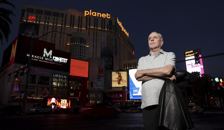 Jeff German, host of &amp;quot;Mobbed Up,&amp;quot; poses with Planet Hollywood, formerly the Aladdin, in the background on the Strip in Las Vegas, on June 2, 2021. Clark County Public Administrator Robert &amp;quot;Rob&amp;quot; Telles is due to be formally charged Tuesday, Sept. 13, 2022, with “premeditated” murder in the stabbing death of German, a Las Vegas investigative reporter who authorities said clawed and fought for his life when he was attacked outside his home. (K.M. Cannon/Las Vegas Review-Journal via AP)