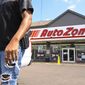 A man carrying a firearm on his hip for protection leaves an Auto Zone store, Thursday, Sept. 8, 2022, in Memphis, Tenn. (AP Photo/John Amis, File)