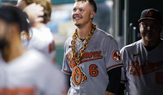 Baltimore Orioles&#39; Ryan Mountcastle smiles in the dugout after his solo home run against the Washington Nationals during the fifth inning of a baseball game at Nationals Park, Tuesday, Sept. 13, 2022, in Washington. (AP Photo/Alex Brandon)