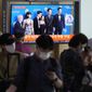 A TV screen show the casting members of Squid Game during a news program at the Seoul Railway Station in Seoul, South Korea, Tuesday, Sept. 13, 2022. (AP Photo/Ahn Young-joon)