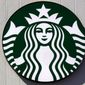 The logo on a sign outside the Starbucks coffee shop, March 14, 2022, in Londonderry, N.H. Starbucks plans to spend $450 million next year to make its North American stores more efficient and less complex. The company also said it plans to open 2,000 net new stores in the U.S. by 2025. The emphasis will be on meeting the growing demand for drive-thru and delivery. Starbucks recently saw the best week in its 51-year history when it introduced its latest fall drinks. But it says stores need better equipment to make drinks more quickly. Among the things driving the revamp is an ongoing unionization effort, which Starbucks opposes. More than 230 U.S. stores have voted to unionize since late last year. (AP Photo/Charles Krupa, file)