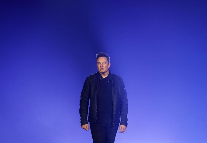 Tesla CEO Elon Musk introduces the Cybertruck at Tesla&#39;s design studio Thursday, Nov. 21, 2019, in Hawthorne, Calif. (AP Photo/Ringo H.W. Chiu, File)