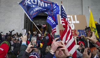 Insurrectionists loyal to President Donald Trump riot outside the U.S. Capitol in Washington, on Jan. 6, 2021. (AP Photo/John Minchillo, File)