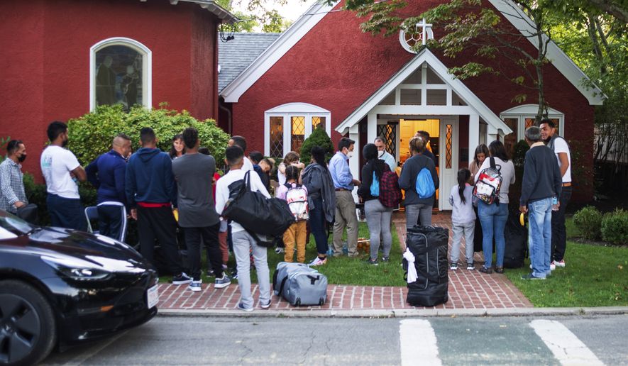 Immigrants gather with their belongings outside St. Andrews Episcopal Church, Wednesday Sept. 14, 2022, in Edgartown, Mass., on Martha&#39;s Vineyard. Florida Gov. Ron DeSantis on Wednesday flew two planes of immigrants to Martha&#39;s Vineyard, escalating a tactic by Republican governors to draw attention to what they consider to be the Biden administration&#39;s failed border policies. (Ray Ewing/Vineyard Gazette via AP) ** FILE **