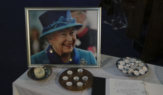 A book of condolence and photo of Queen Elizabeth II are displayed at a church in the district of Southall in London, Tuesday, Sept. 13, 2022. In a church in a West London district known locally as Little India, a book of condolence for Queen Elizabeth II lies open. Five days after the monarch’s passing, few have signed their names. The congregation of 300 is made up largely of the South Asian diaspora, like the majority of the estimated 70,000 people living in the district of Southall, a community tucked away in London&#39;s outer reaches of London and built on waves of migration that span 100 years. (AP Photo/Kin Cheung)