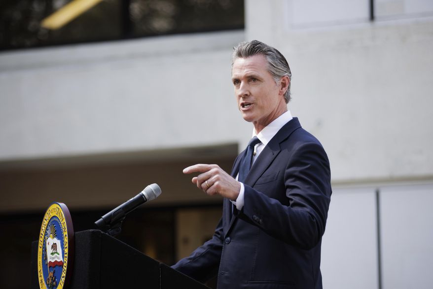 California Governor Gavin Newsom speaks before signing legislation establishing the Community Assistance, Recovery and Empowerment Act, in San Jose, Calif., Wednesday, Sept. 14, 2022. The CARE program allows family members, first responders and others to ask a judge to draw up a treatment plan for someone diagnosed with certain disorders, including schizophrenia. (Dai Sugano/Bay Area News Group via AP)