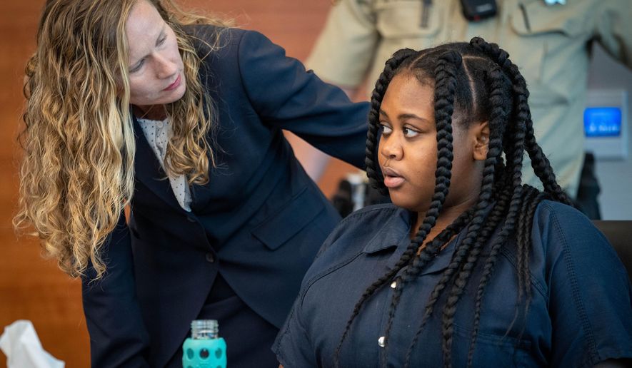 Pieper Lewis, right, speaks with attorney Magdalena Reese during a sentencing hearing Wednesday, Sept. 7, 2022, in Des Moines, Iowa. Donations are pouring in to help Lewis, a 17-year-old sex trafficking victim who was ordered by the court to pay $150,000 to the family of a man she stabbed to death after he raped her. A GoFundMe campaign set up for Pieper Lewis has already raised more than $200,000 just one day after the restitution order was handed down by an Iowa judge. (Zach Boyden-Holmes/The Des Moines Register via AP, File)