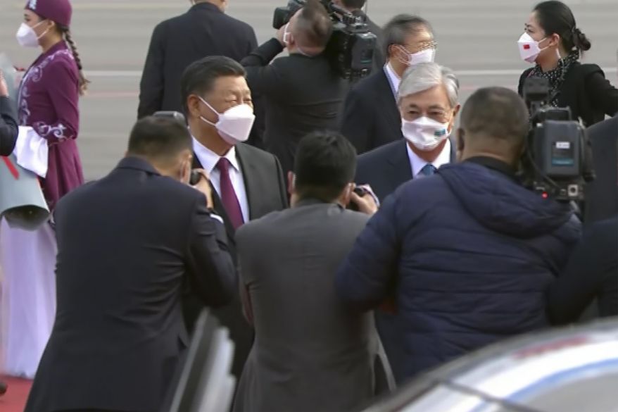 In this image taken from video, Chinese President Xi Jinping, left, is greeted Kazakhstan President Kassym-Jomart Tokayev, right, and other officials as he arrives in Nur-Sultan, Kazakhstan, Wednesday, Sept. 14, 2022. Xi started his first foreign trip abroad Wednesday since the outbreak of the pandemic with a stop in Kazakhstan ahead of a summit with Russia’s Vladimir Putin and other leaders of a Central Asian security group. (Kaz Media via AP)