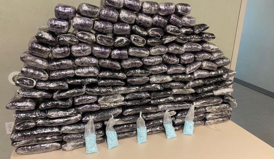 This undated file photo provided by the U.S. Drug Enforcement Administration, Los Angeles Field Division, shows some of the seized approximately 1 million fake pills containing fentanyl that were seized when agents served a search warrant, July 5, 2022, at a home in Inglewood, Calif. (Drug Enforcement Administration via AP, File)