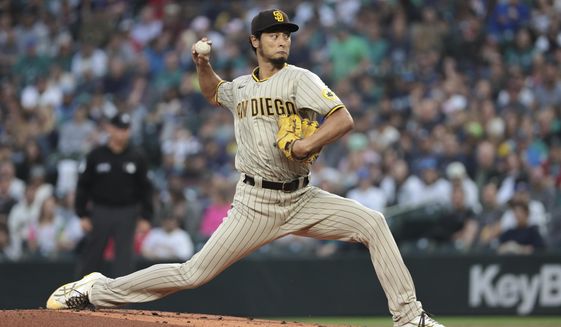 San Diego Padres starting pitcher Yu Darvish throws to a Seattle Mariners batter during the first inning of a baseball game Tuesday, Sept. 13, 2022, in Seattle. (AP Photo/Jason Redmond)