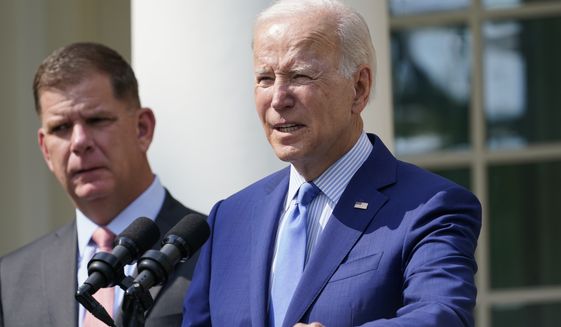 President Joe Biden, with Secretary of Labor Marty Walsh, left, speaks about a tentative railway labor agreement in the Rose Garden of the White House, Thursday, Sept. 15, 2022, in Washington. (AP Photo/Susan Walsh)