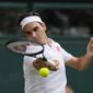 Switzerland&#39;s Roger Federer plays a return to Poland&#39;s Hubert Hurkacz during the men&#39;s singles quarterfinals match on day nine of the Wimbledon Tennis Championships in London, July 7, 2021. Federer announced Thursday, Sept. 15, 2022, he is retiring from tennis. (AP Photo/Kirsty Wigglesworth)