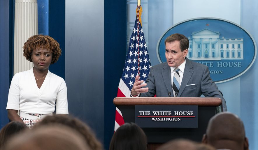 White House press secretary Karine Jean-Pierre, left, listens as National Security Council spokesman John Kirby speaks to reporters in the James Brady Press Briefing Room at the White House, Friday, Sept. 16, 2022, in Washington. (AP Photo/Alex Brandon)