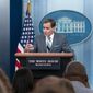 White House press secretary Karine Jean-Pierre, left, listens as National Security Council spokesman John Kirby speaks to reporters in the James Brady Press Briefing Room at the White House, Friday, Sept. 16, 2022, in Washington. (AP Photo/Alex Brandon)