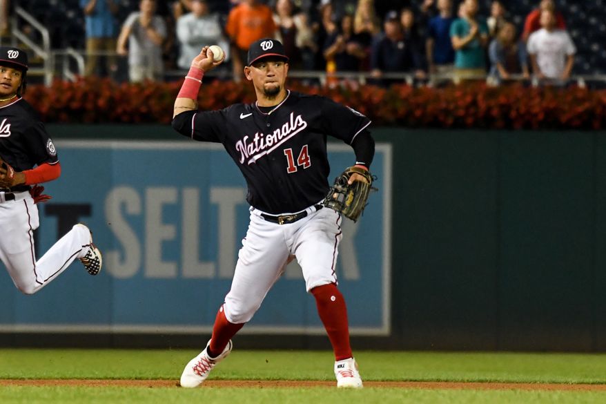Washington Nationals third baseman Ildemaro Vargas (14) fielding a ground ball during the 9th inning in a game against the Miami Marlins at Nationals Park in Washington D.C., September 16, 2022. (Photo by All-Pro Reels)