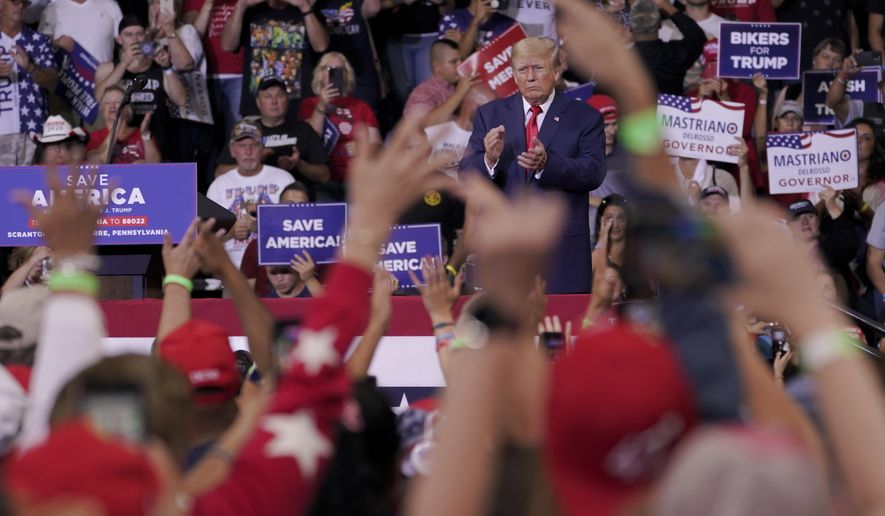 Former President Donald Trump speaks at a rally in Wilkes-Barre, Pa., Sept. 3, 2022. Trump is increasingly embracing and endorsing the QAnon conspiracy theory, even as the number of frightening real-world incidents linked to the movement increase.(AP Photo/Mary Altaffer, File)