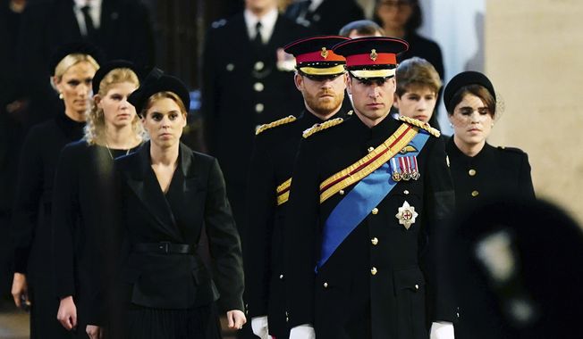 Left to right: Zara Tindall, Lady Louise, Princess Beatrice, Prince William, the prince of Wales, Prince Harry, Princess Eugenie, Viscount James Severn and Peter Phillips attend the vigil of the Queen&#x27;s grandchildren around the coffin, as it lies in state on the catafalque in Westminster Hall, at the Palace of Westminster, London, Saturday,  Sept. 17, 2022, ahead of her funeral on Monday. (Aaron Chown/Pool Photo via AP)