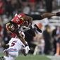 Maryland safety Beau Brade, top, intercepts a pass and is tackled by SMU&#39;s Moochie Dixon in the first half of an NCAA college football game, Saturday, Sept. 17, 2022, in College Park, Md. (AP Photo/Gail Burton)
