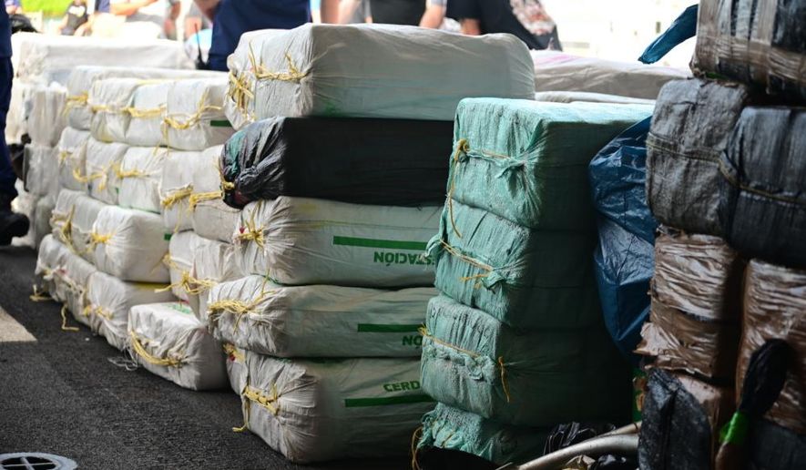 Bales of illegal drugs, worth an estimated $475 million, are offloaded onto pallets, Sept. 15, 2022, at Coast Guard Base Miami Beach, Florida. The illegal narcotics were offloaded by the crew of the U.S. Coast Guard Cutter Legare (WMEC 912). (U.S. Coast Guard photo by Petty Officer 3rd Class Mikaela McGee)