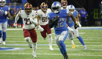 Detroit Lions running back D&#39;Andre Swift (32) rushes in the first half against the Washington Commanders during an NFL football game, Sunday, Sept. 18, 2022, in Detroit. (AP Photo/Rick Osentoski)