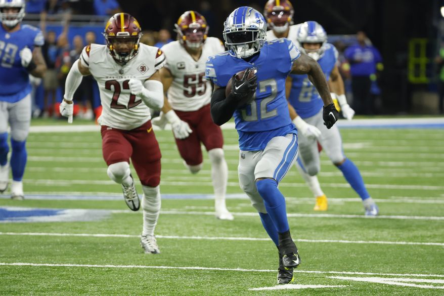 Detroit Lions running back D&#39;Andre Swift (32) rushes in the first half against the Washington Commanders during an NFL football game, Sunday, Sept. 18, 2022, in Detroit. (AP Photo/Rick Osentoski)