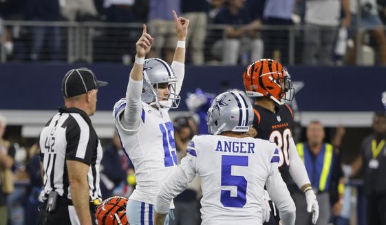 Dallas Cowboys place kicker Brett Maher (19) celebrates his game winning field goal with punter Bryan Anger (5) during the second half of an NFL football game Sunday, Sept. 18, 2022, in Arlington, Tx. (AP Photo/Michael Ainsworth)