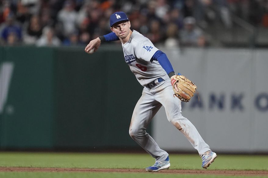 Los Angeles Dodgers shortstop Trea Turner throws out San Francisco Giants&#x27; Heliot Ramos at first base during the fifth inning of a baseball game in San Francisco, Saturday, Sept. 17, 2022. (AP Photo/Jeff Chiu) **FILE**