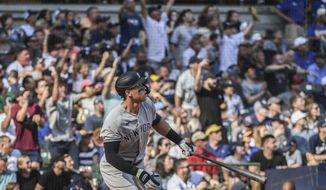 New York Yankees&#39; Aaron Judge looks up after hitting his 59th home run during the seventh inning of a baseball game against the Milwaukee Brewers, Sunday, Sept. 18, 2022, in Milwaukee. (AP Photo/Kenny Yoo)