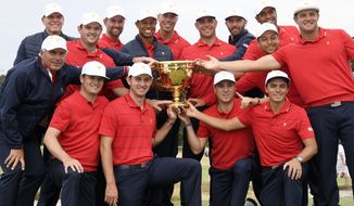 The U.S. team hold their trophy after they won the President&#39;s Cup golf tournament at Royal Melbourne Golf Club in Melbourne, Sunday, Dec. 15, 2019. The U.S. team won the tournament 16-14. The last Presidents Cup was so close the International team walked away with renewed hope that it had enough game and enough fight to conquer the mighty Americans. (AP Photo/Andy Brownbill) ** FILE **