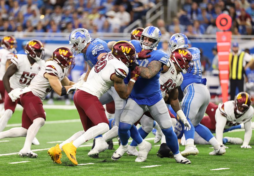 Washington Commanders&#39; DE Montez Sweat (90) defends the line, making a hold against the Lions Offense at the Washington Commanders vs the Detroit Lions at Ford Field in Detroit Michigan on September 18th 2022 (Photo: Alyssa Howell)