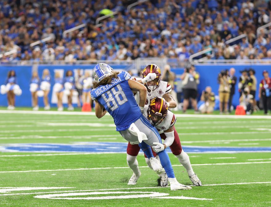 Washington Commanders&#39; Defensemen tackle Lions&#39; TE T.J. Hockenson (88) at the Washington Commanders vs the Detroit Lions at Ford Field in Detroit Michigan on September 18th 2022 (Photo: Alyssa Howell)