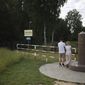 People visit the area of tripoint marking the place where borders of Poland, Lithuania and Russia&#39;s Kaliningrad Oblast meet, in Zerdziny, Poland, July 7, 2022. Estonia, Latvia and Lithuania closed their borders Monday, Sept. 19, 2022, to most Russian citizens in response to the wide domestic support in Russia for the war in Ukraine. Under the coordinated travel ban, Russians wishing to travel to the Baltic countries or Poland as tourists or for business, sports or cultural purposes will not be allowed in even if they hold valid visas for the European Union&#39;s checks-free Schengen Area. (AP Photo/Michal Dyjuk, File)