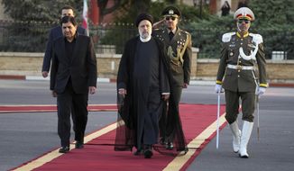 Iranian President Ebrahim Raisi, center, reviews an honor guard during his official departure ceremony as he leaves Tehran&#39;s Mehrabad airport to New York to attend annual UN General Assembly meeting, Monday, Sept. 19, 2022. Raisi headed to New York on Monday, where he will be speaking to the U.N. General Assembly later this week, saying that he has no plans to meet with President Joe Biden on the sidelines of the U.N. event. (AP Photo/Vahid Salemi)