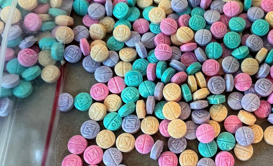 Two New York City men were charged after the Drug Enforcement Administration seized 300,000 rainbow-colored fentanyl pills and 22 pounds of powdered fentanyl worth $9 million, and an assault weapon, from a Bronx apartment. (DEA photo)