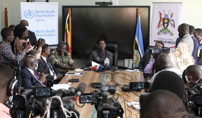 Permanent Secretary of the Ministry of Health Diana Atwine, center, confirms a case of Ebola in the country, at a press conference in Kampala, Uganda Tuesday, Sept. 20, 2022. Ugandan health authorities on Tuesday reported that a man who died a day earlier had tested positive for the virus that causes Ebola and referred to a potential new outbreak. (AP Photo/Hajarah Nalwadda)