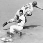 Los Angeles Dodgers&#x27; Maury Wills is safe at third as St. Louis Cardinals&#x27; Ken Boyer takes the throw during the first inning of a baseball game in Los Angeles, Sept. 26, 1965. Maury Wills, who helped the Los Angeles Dodgers win three World Series titles with his base-stealing prowess, has died. The team says Wills died Monday night, Sept. 19, 2022, in Sedona, Ariz. He was 89.  (AP Photo/FW) **FILE**