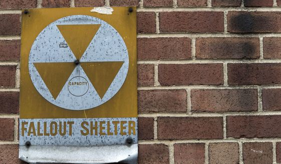 A fallout shelter sign hangs on a building on East 9th Street in New York on Jan. 16, 2018. (AP Photo/Mary Altaffer) **FILE**