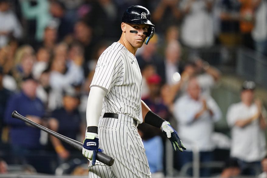 New York Yankees&#39; Aaron Judge talks to Harrison Bader as he walks toward home plate for his at-bat during the eighth inning of the team&#39;s baseball game against the Pittsburgh Pirates on Wednesday, Sept. 21, 2022, in New York. Judge walked on the at-bat. (AP Photo/Frank Franklin II)