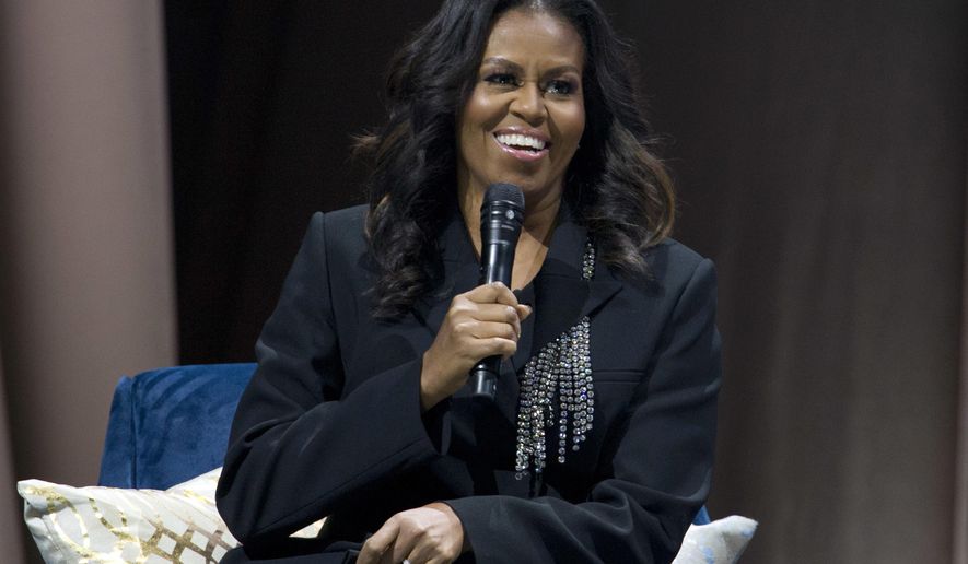 Former first lady Michelle Obama speaks to the crowd as she presents her anticipated memoir &amp;quot;Becoming&amp;quot; during her book tour stop in Washington, on Nov. 17, 2018. Obama plans a six-city tour this fall in support of her new book, “The Light We Carry: Overcoming in Uncertain Times,” beginning mid-November in Washington. D.C. and ending a month later in Los Angeles. (AP Photo/Jose Luis Magana, File)