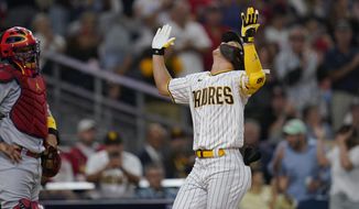 San Diego Padres&#39; Ha-Seong Kim reacts after hitting a home run during the fourth inning of the team&#39;s baseball game against the St. Louis Cardinals, Tuesday, Sept. 20, 2022, in San Diego. (AP Photo/Gregory Bull)