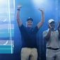LIV Golf CEO Greg Norman, left, and LIV Golf managing director Majed Al Sorour cheer from the stage before the trophy presentation at the LIV Golf Invitational-Boston tournament, Sunday, Sept. 4, 2022, in Bolton, Mass. (AP Photo/Mary Schwalm) **FILE**