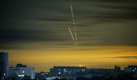 Russian rockets launched against Ukraine from Russia&#39;s Belgorod region are seen at dawn in Kharkiv, Ukraine, Wednesday, Sept. 21, 2022. (AP Photo/Vadim Belikov)