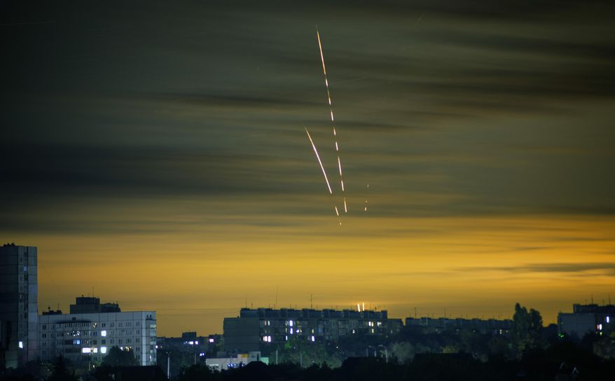 Russian rockets launched against Ukraine from Russia&#39;s Belgorod region are seen at dawn in Kharkiv, Ukraine, Wednesday, Sept. 21, 2022. (AP Photo/Vadim Belikov)