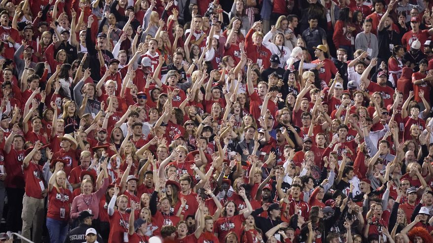 The Utah student section show their support during the first half of an NCAA college football game against San Diego State and Utah Saturday, Sept. 17, 2022, in Salt Lake City. A University of Utah student was arrested on suspicion of making terrorist threats after police said she threatened to detonate a nuclear reactor if the school&#39;s football team failed to win a game last Saturday. Charging documents filed in Salt Lake City on Wednesday, Sept. 21, 2022 allege that the student posted threats before Utah&#39;s game against San Diego State University on Saturday. (AP Photo/Rick Bowmer) **FILE**