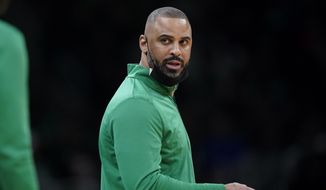 Boston Celtics head coach Ime Udoka speaks from the bench during the first half of an NBA basketball game against the Charlotte Hornets, Wednesday, Feb. 2, 2022, in Boston.  The Boston Celtics are planning to discipline coach Ime Udoka, likely with a suspension, because of an improper relationship with a member of the organization, two people with knowledge of the matter told The Associated Press on Thursday, Sept. 22, 2022.(AP Photo/Steven Senne, File) **FILE**