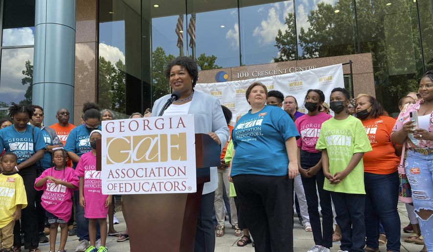 Georgia Democratic nominee for governor Stacey Abrams unveils a teacher pay raise proposal on Sunday, June 12, 2022, in Tucker, Ga. Abrams was accepting the endorsement of the Georgia Association of Educators. (AP Photo/Jeff Amy, File)