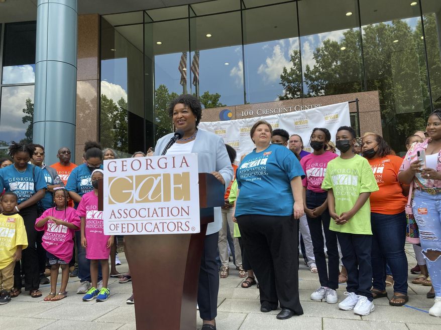 Georgia Democratic nominee for governor Stacey Abrams unveils a teacher pay raise proposal on Sunday, June 12, 2022, in Tucker, Ga. Abrams was accepting the endorsement of the Georgia Association of Educators. (AP Photo/Jeff Amy, File)